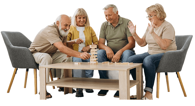 Four Elderly Friends Playing a Block Stacking Game at an Independent Living Facility Four Elderly Friends Playing a Block Stacking Game at an Independent Living Facility