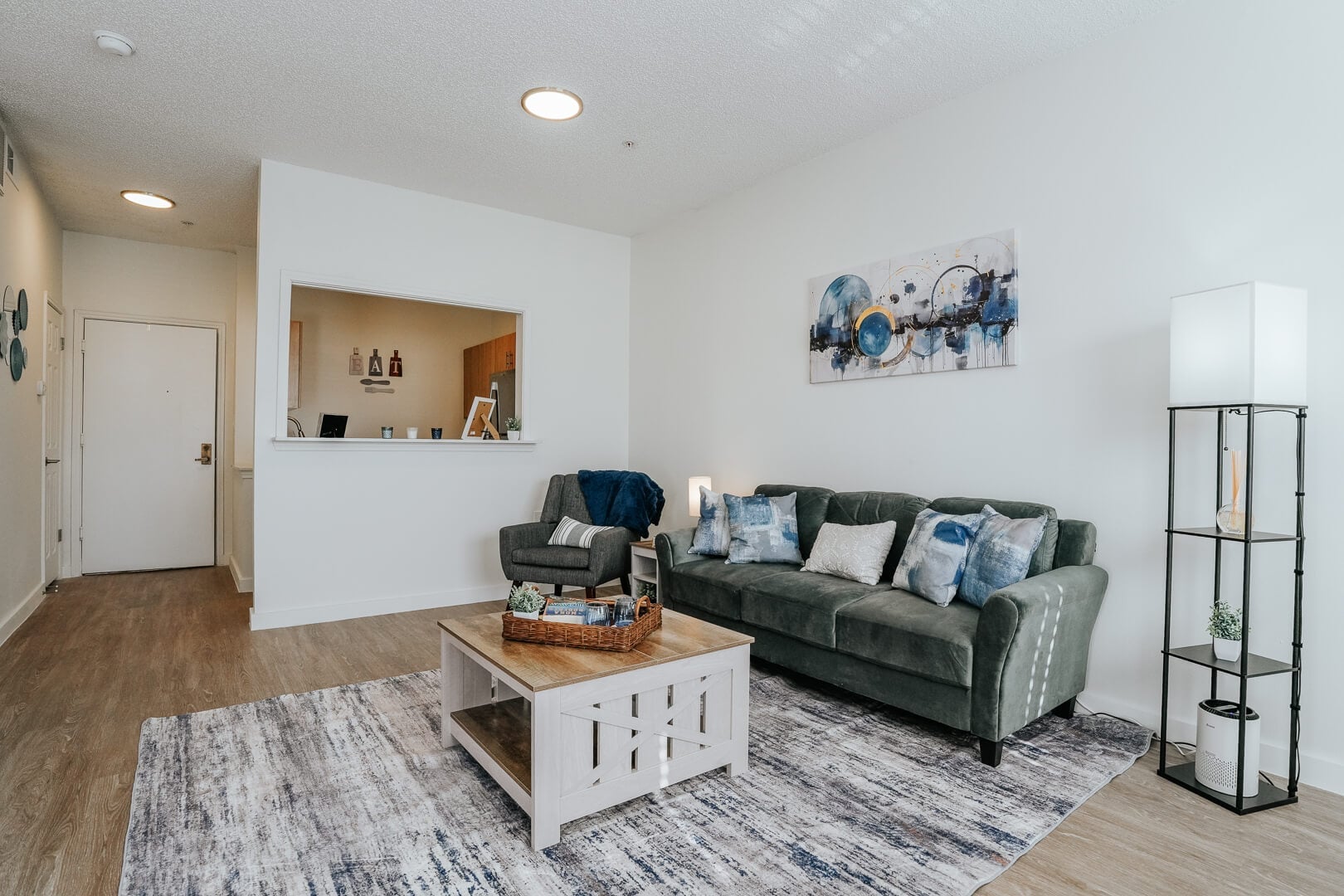 Open Living Area with Seating and Kitchen View inside Our Independent Living Community